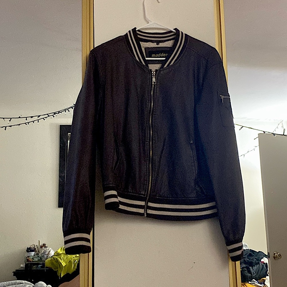 Selling leather jacket size XL in women’s. The color is a purple violet.